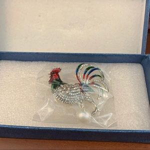 Silver rooster pin